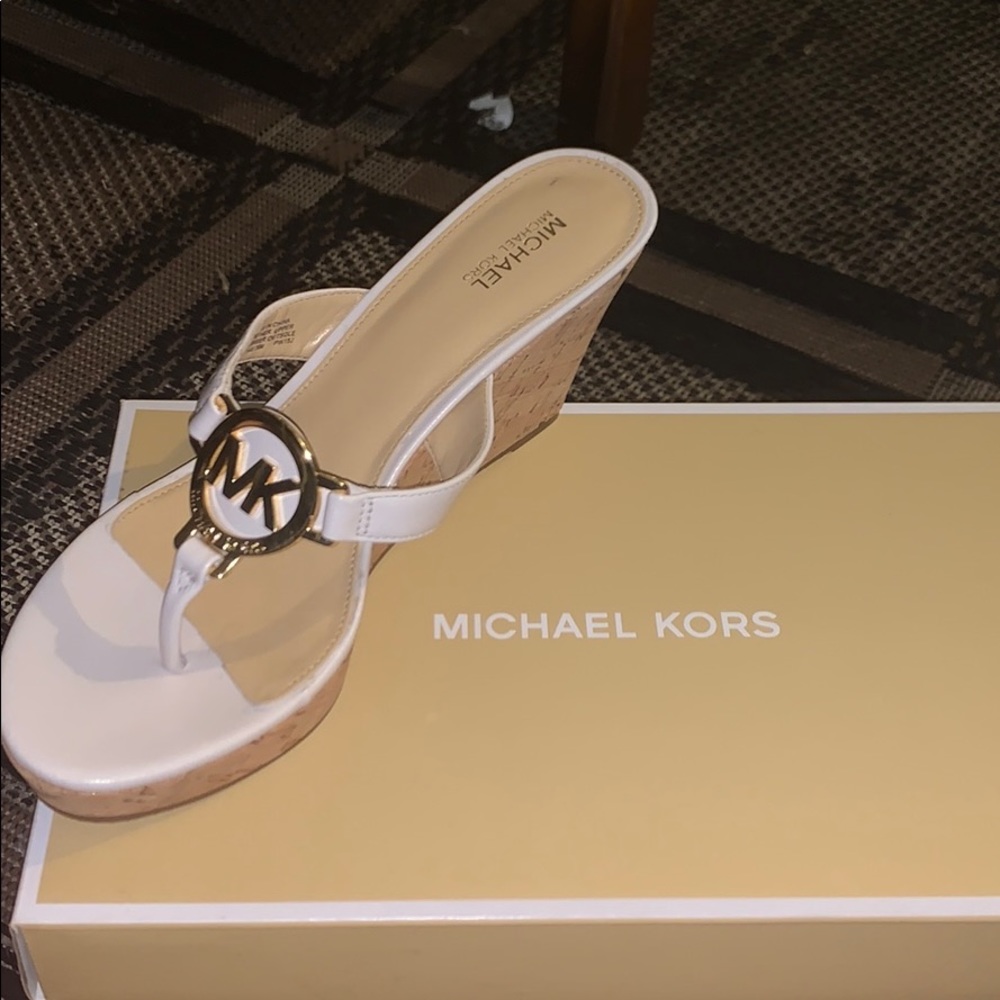 Brand new MK Sandler’s with heel.